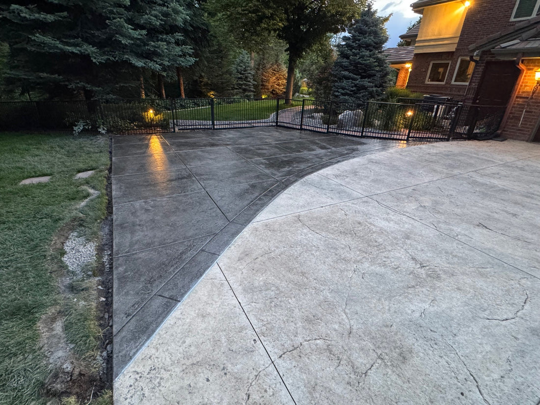 Desert Slate stamped concrete installation in Cherry Hills Village featuring a custom curved transition, decorative stone texture, professional saw cuts, and expert craftsmanship by Pristine Concrete Denver.