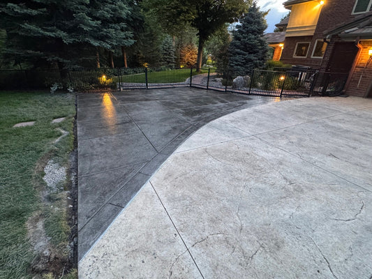 Desert Slate stamped concrete installation in Cherry Hills Village featuring a custom curved transition, decorative stone texture, professional saw cuts, and expert craftsmanship by Pristine Concrete Denver.