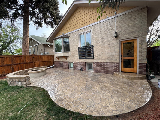 Random stone stamped concrete patio resealed in Denver Colorado