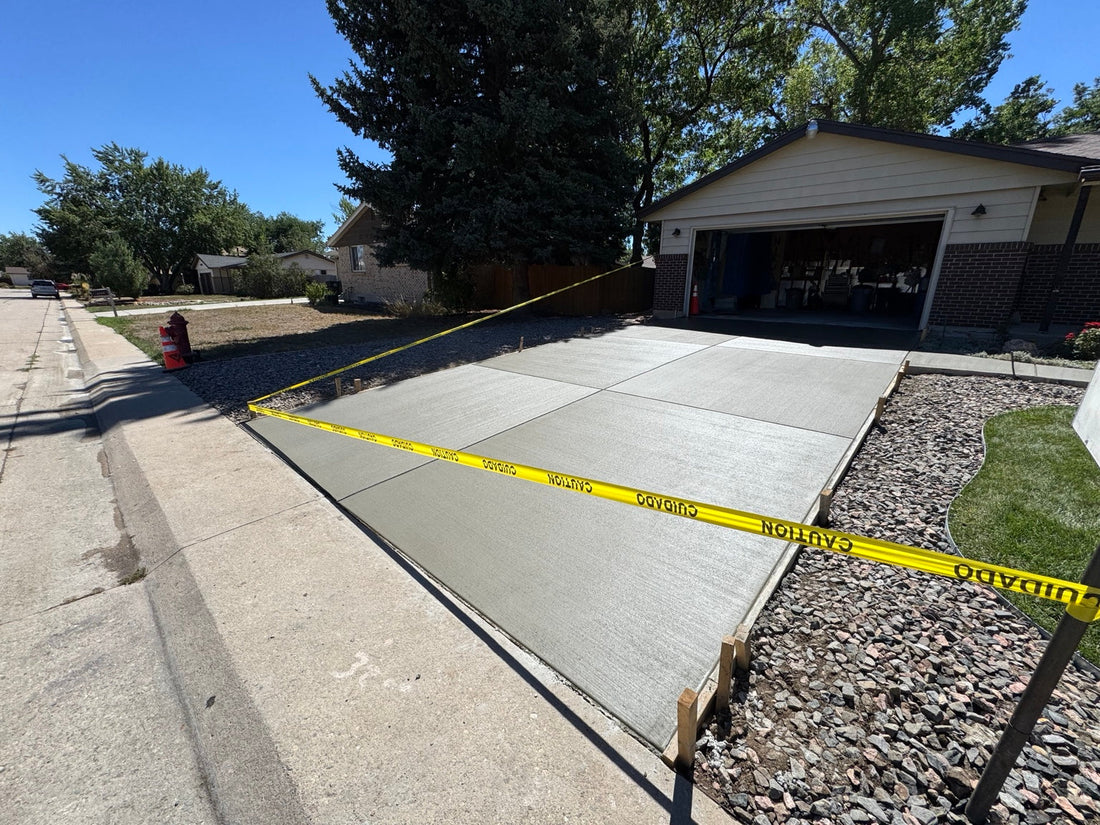 Newly poured concrete driveway with broom finish in Lakewood Colorado