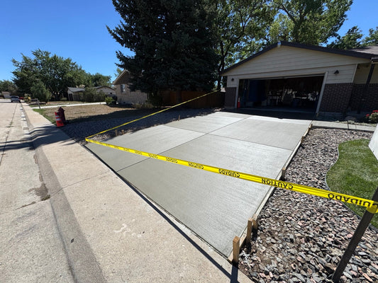 Newly poured concrete driveway with broom finish in Lakewood Colorado