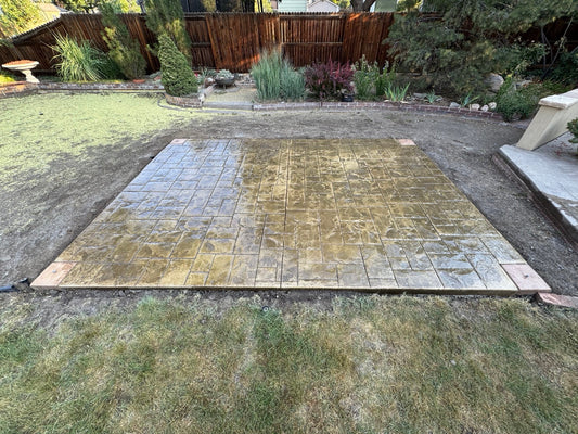 Finished Ashlar Slate stamped concrete patio in Arvada CO with Ginger color and Smokey Beige release