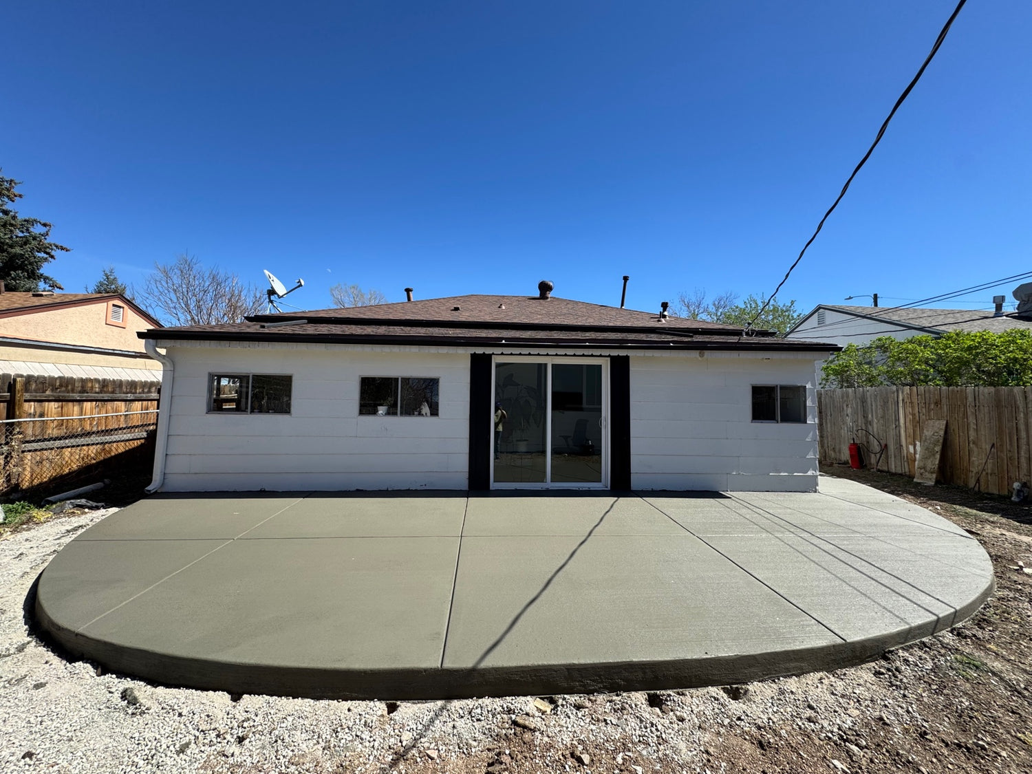 Round broom finish patio installed in Denver, Co by Pristine Concrete Denver