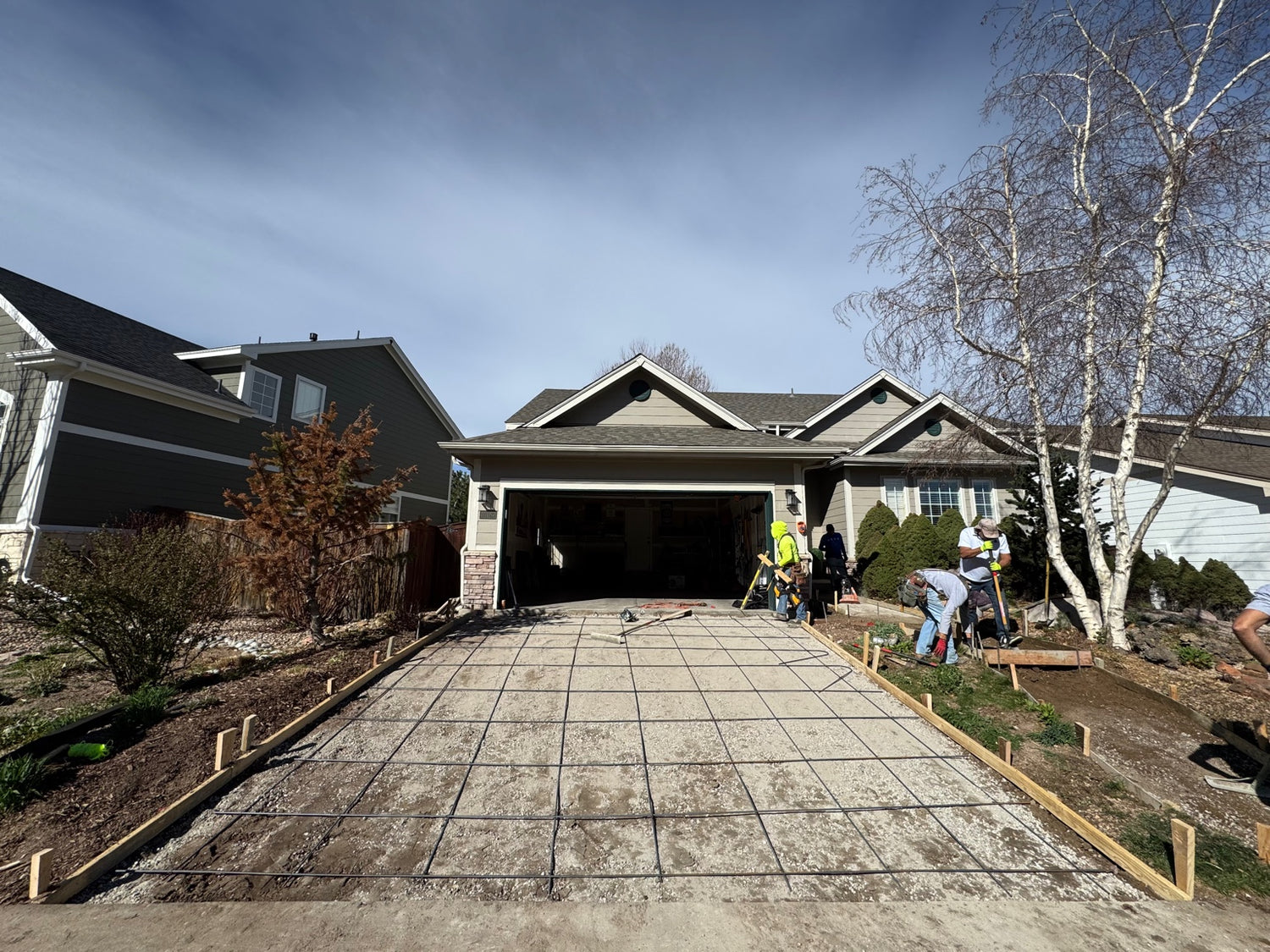Driveway preparation with rebar grid before concrete pour