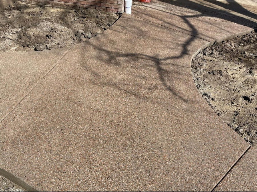 Close-up of a sand finish concrete walkway surface in the Denver area